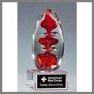 red orange clear egg shaped art glass award made by hand
